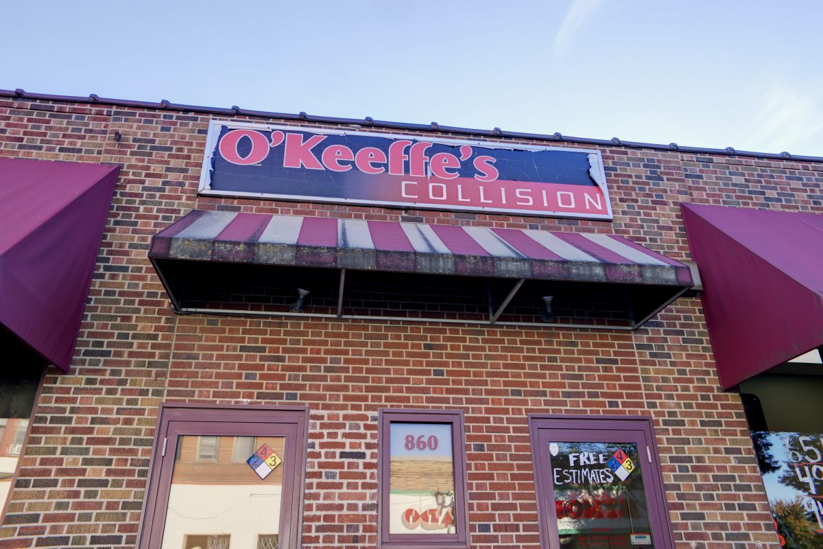 The corner of the O'Keeffe's Collision building with its awnings